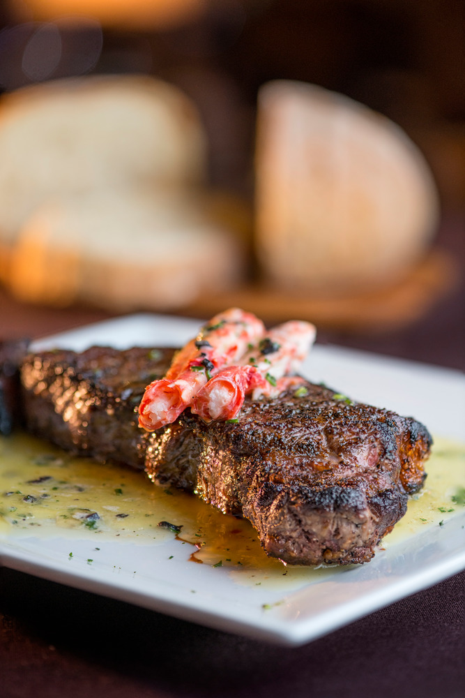 Prime New York Strip with Truffle Buttered King Crab