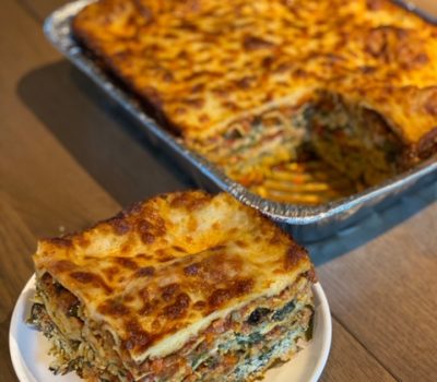 Seven-layer pork lasagna made with our Famous Seven-Finger-High Pork Chop, spinach ricotta, parmesan and mozzarella cheese and ratatouille style vegetables including zucchini, peppers, eggplant, tomatoes and garlic.