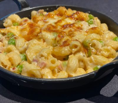 Rich, creamy Mac & Cheese embellished with savory bites of Perry’s Famous Pork Chop. Featuring three different cheeses, this Mac & Cheese is brought together into a warming bite with hints of nutmeg, then baked to melty, bubbly, and golden-brown perfection. 